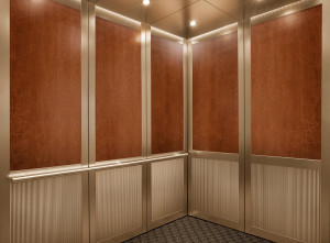 FSRT844 Интерьер лифта Levelc-2000n с верхними панелями из шпона американской вишни; нижние панели из плавленой бронзы, отделка морским камнем, узор далласского тиснения; стойки и поручни из плавленой бронзы, отделка кайзером; секстант поручень из атласно Forms-surfaces 