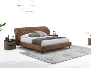 Кожаная двуспальная кровать с капитонным изголовьем